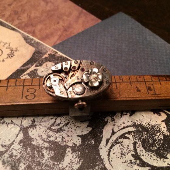 Vintage Bulova Oval Watch Movement Ring with Antique Flower Charm - The Victorian Magpie